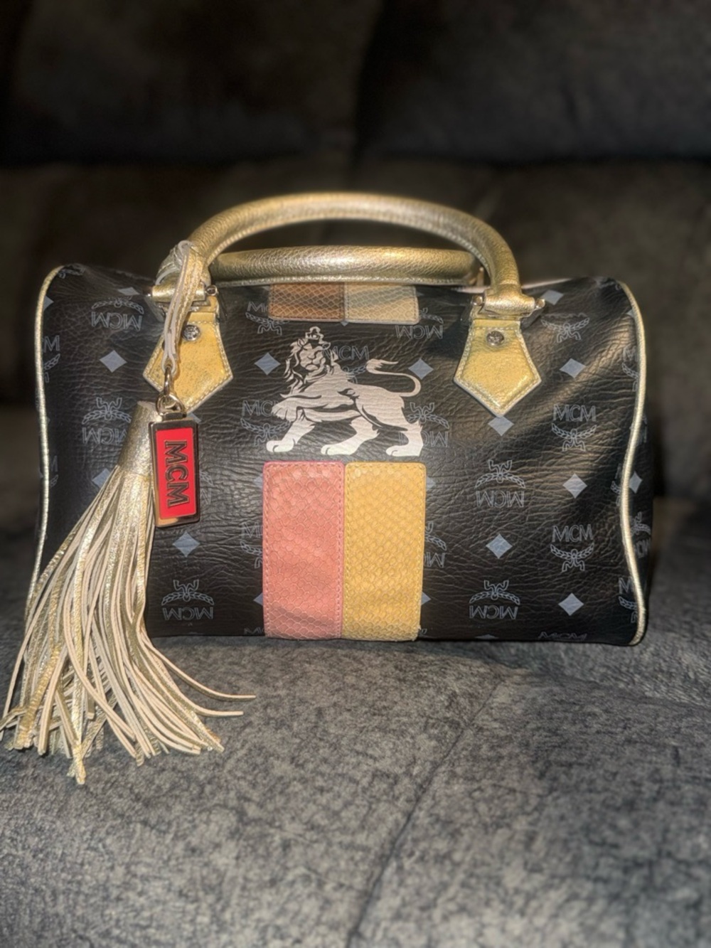 MCM Princess Lion Black Satchel with Pink and Yellow Stripe and Gold Accents